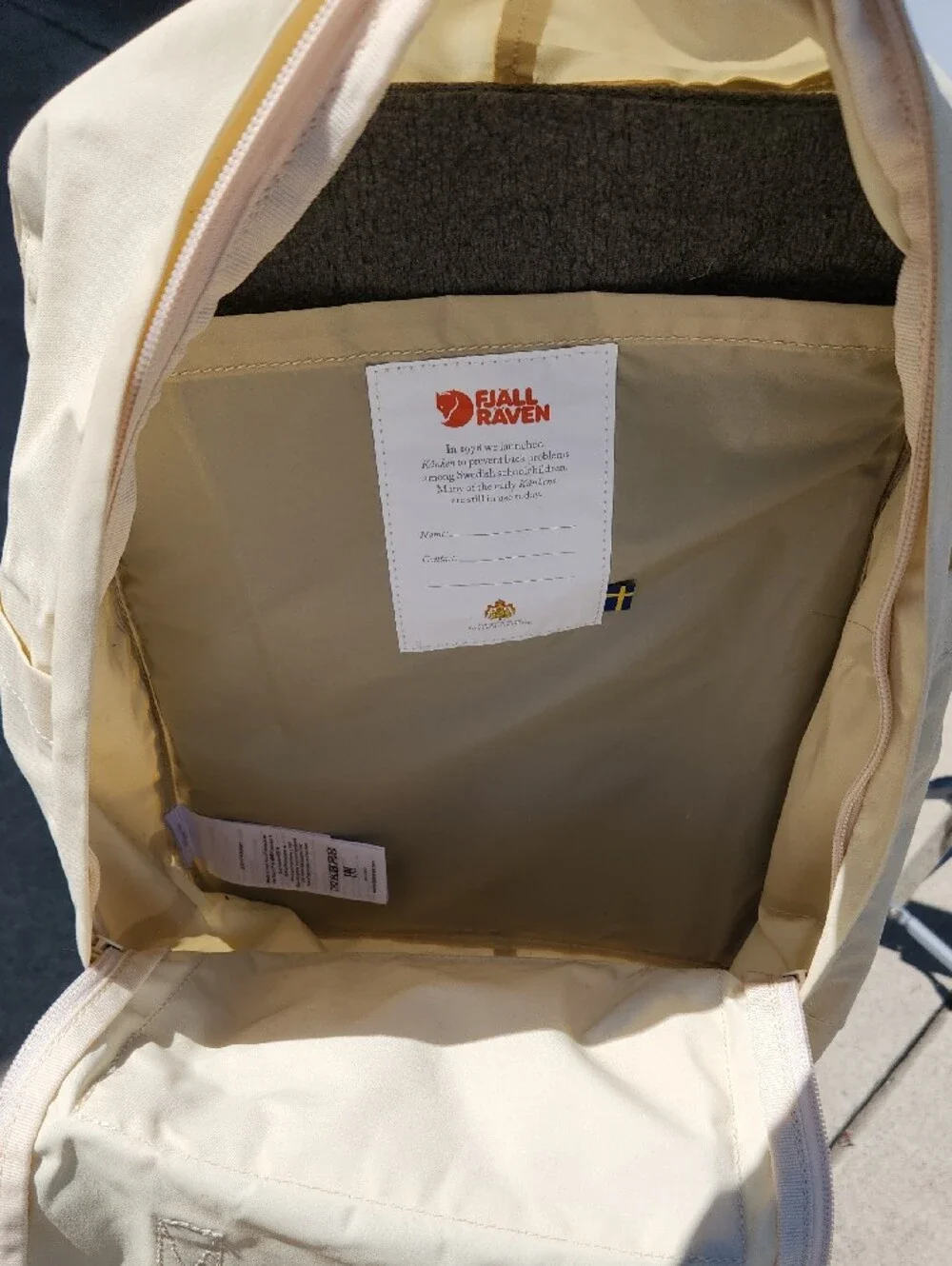 Fjallraven Kanken Backpack in Cream with Red Logo Patch